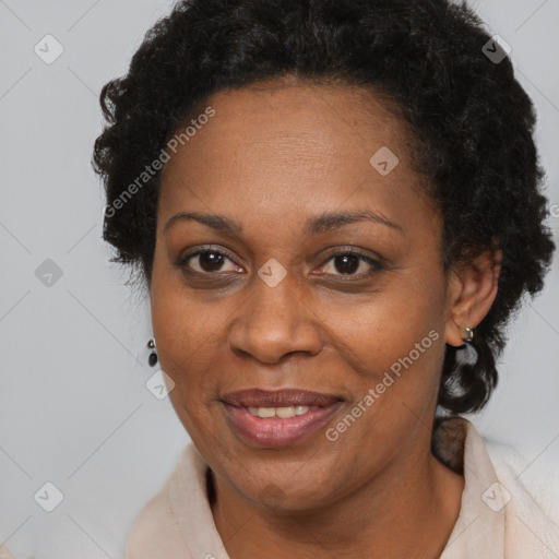 Joyful black adult female with short  brown hair and brown eyes