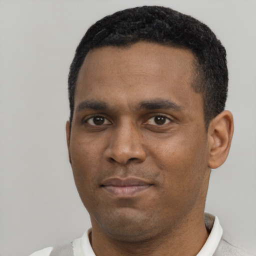 Neutral black young-adult male with short  black hair and brown eyes