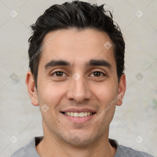 Joyful white young-adult male with short  black hair and brown eyes