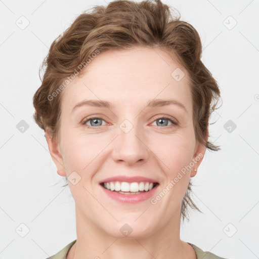 Joyful white young-adult female with medium  brown hair and blue eyes