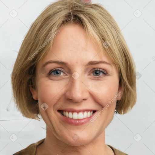 Joyful white adult female with medium  brown hair and blue eyes