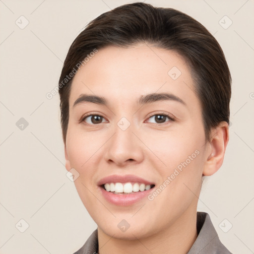 Joyful white young-adult female with short  brown hair and brown eyes