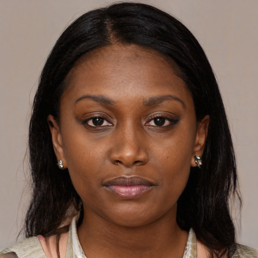 Neutral black young-adult female with medium  brown hair and brown eyes