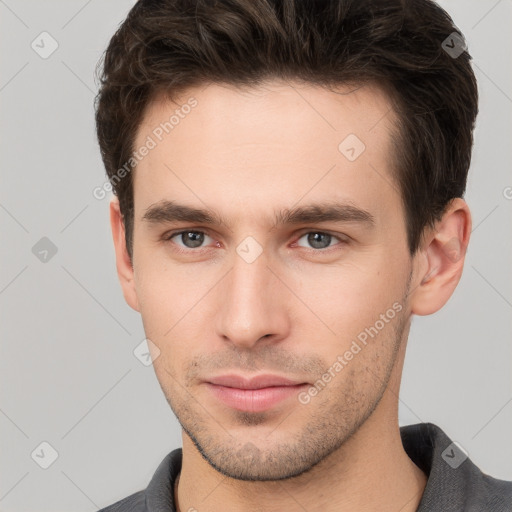 Neutral white young-adult male with short  brown hair and brown eyes