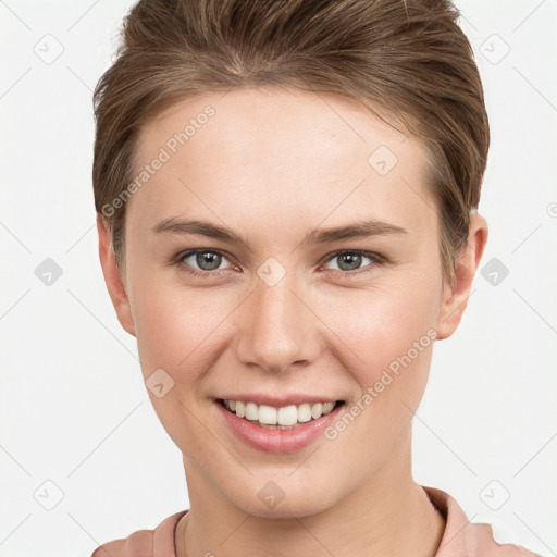 Joyful white young-adult female with short  brown hair and grey eyes