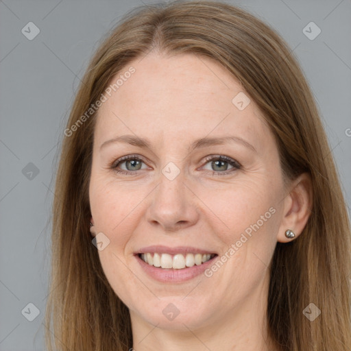 Joyful white adult female with long  brown hair and grey eyes