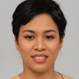 Joyful asian young-adult female with short  black hair and brown eyes