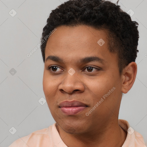 Joyful black young-adult male with short  black hair and brown eyes