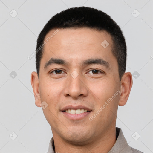 Joyful white young-adult male with short  black hair and brown eyes