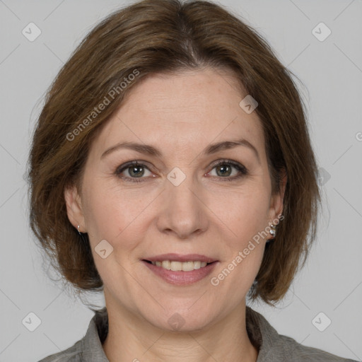 Joyful white adult female with medium  brown hair and grey eyes