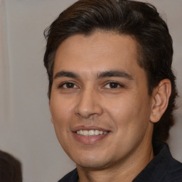 Joyful white young-adult male with medium  brown hair and brown eyes