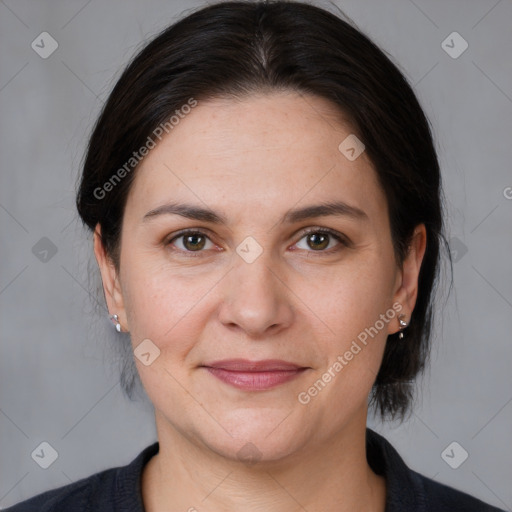 Joyful white adult female with medium  brown hair and brown eyes