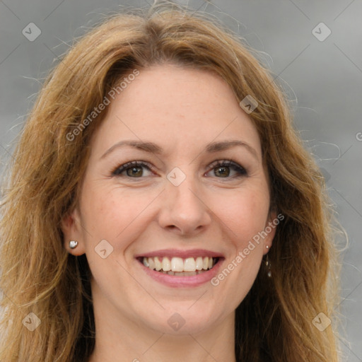 Joyful white young-adult female with long  brown hair and green eyes