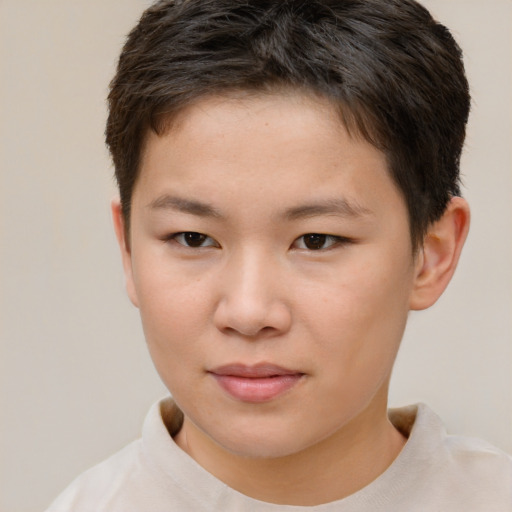Joyful white child female with short  brown hair and brown eyes