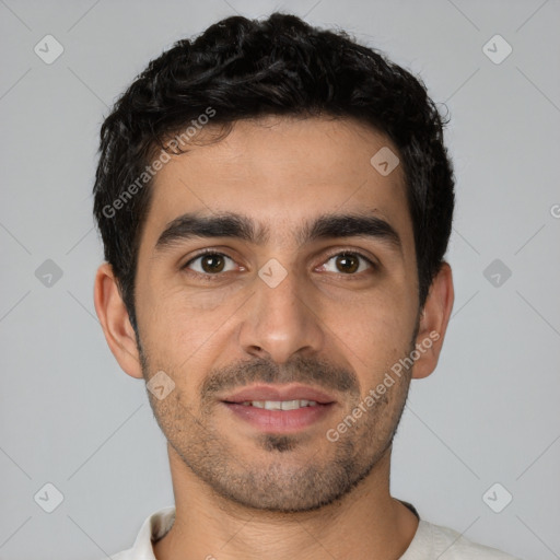 Joyful white young-adult male with short  black hair and brown eyes