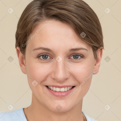 Joyful white young-adult female with short  brown hair and grey eyes