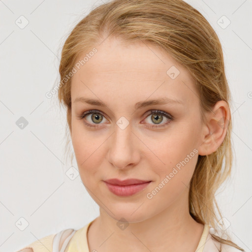 Joyful white young-adult female with medium  brown hair and blue eyes