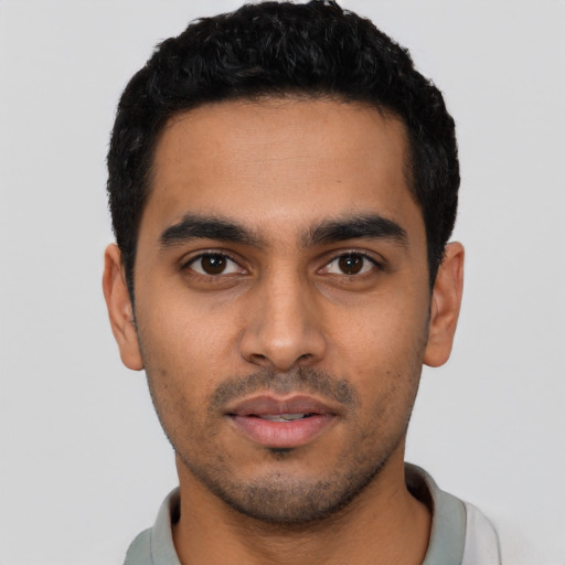 Neutral latino young-adult male with short  black hair and brown eyes