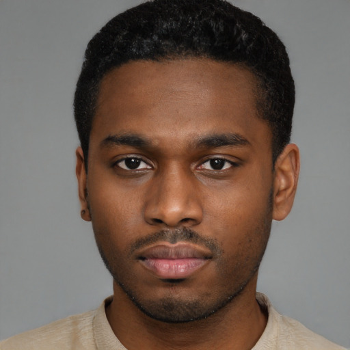 Neutral black young-adult male with short  black hair and brown eyes