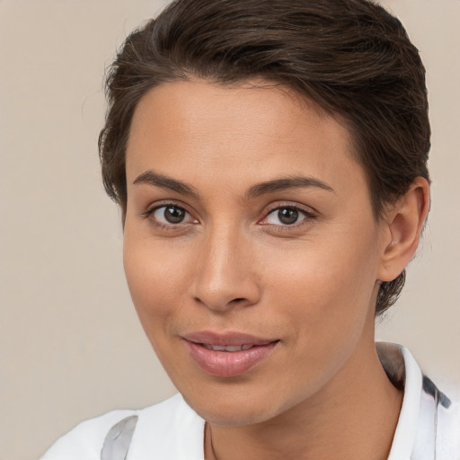 Joyful white young-adult female with medium  brown hair and brown eyes