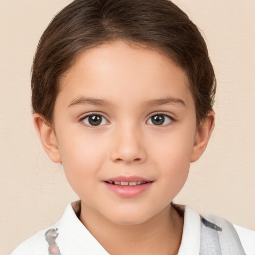 Joyful white child female with short  brown hair and brown eyes