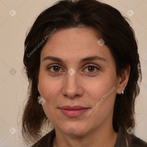 Joyful white adult female with medium  brown hair and brown eyes