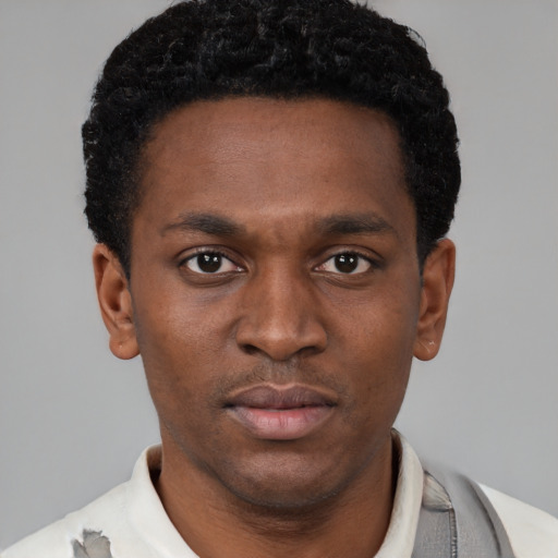 Neutral latino young-adult male with short  brown hair and brown eyes