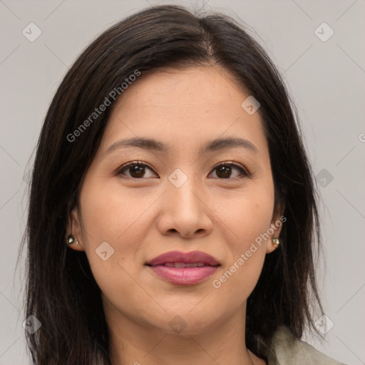 Joyful asian young-adult female with long  brown hair and brown eyes