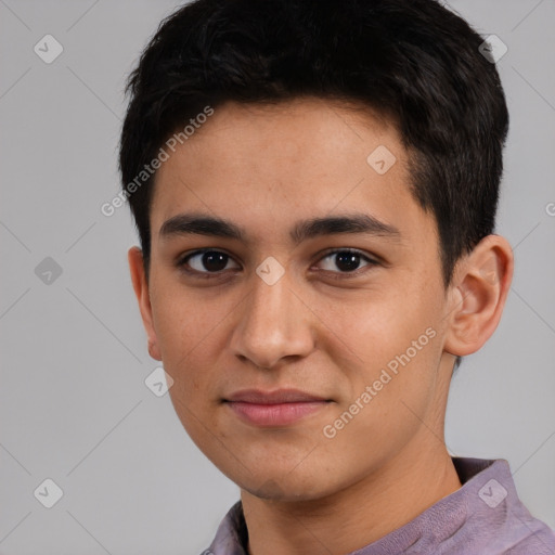 Joyful white young-adult male with short  black hair and brown eyes