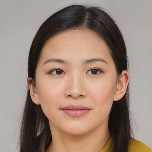 Joyful white young-adult female with long  brown hair and brown eyes