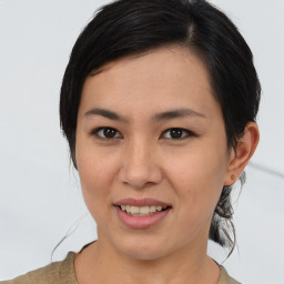 Joyful asian young-adult female with medium  brown hair and brown eyes