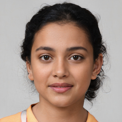 Joyful latino young-adult female with medium  black hair and brown eyes