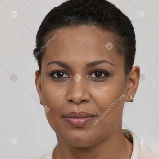 Joyful black young-adult female with short  brown hair and brown eyes