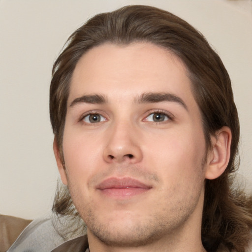 Joyful white young-adult male with medium  brown hair and brown eyes