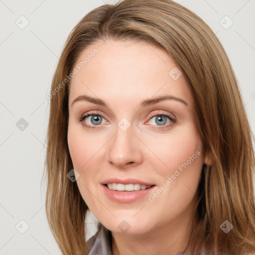 Joyful white young-adult female with long  brown hair and blue eyes