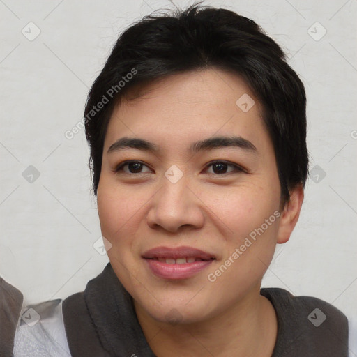 Joyful asian young-adult female with short  black hair and brown eyes