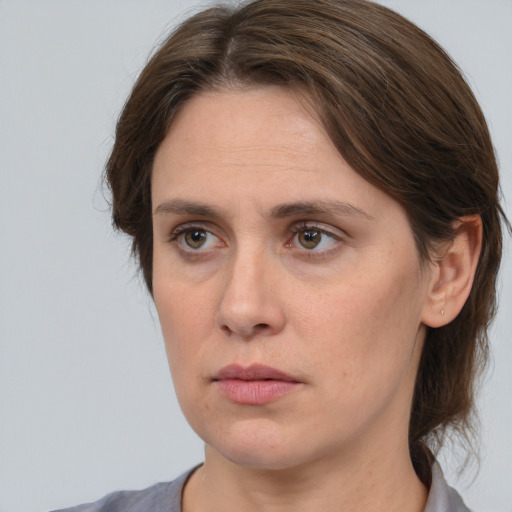 Neutral white adult female with medium  brown hair and brown eyes