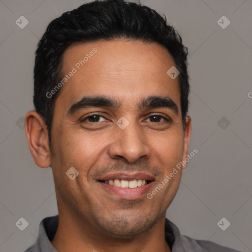 Joyful latino young-adult male with short  black hair and brown eyes