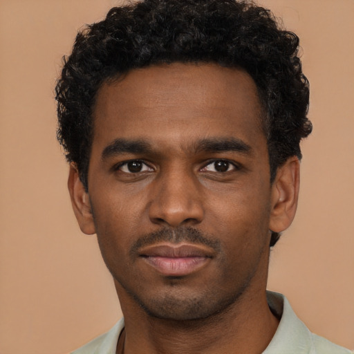 Neutral black young-adult male with short  black hair and brown eyes