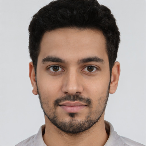 Neutral latino young-adult male with short  black hair and brown eyes