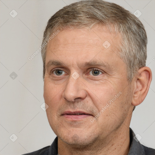 Joyful white middle-aged male with short  brown hair and brown eyes