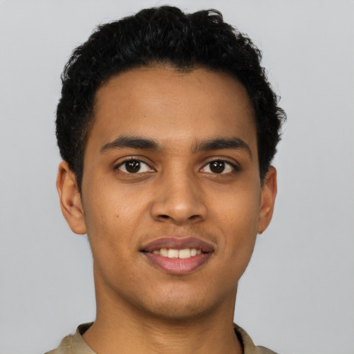 Joyful latino young-adult male with short  brown hair and brown eyes