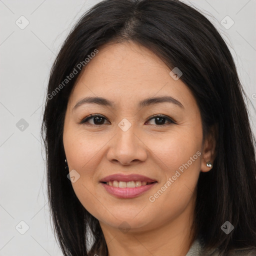 Joyful asian young-adult female with long  brown hair and brown eyes