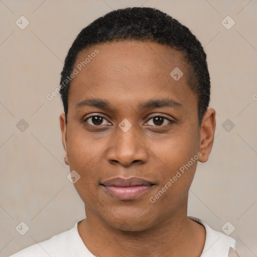 Joyful black young-adult male with short  black hair and brown eyes