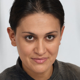 Joyful white adult female with short  brown hair and brown eyes