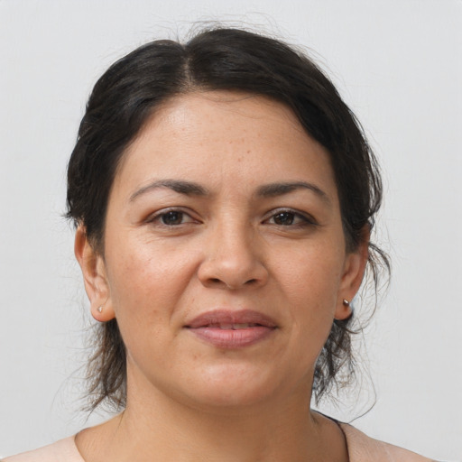 Joyful asian adult female with medium  brown hair and brown eyes