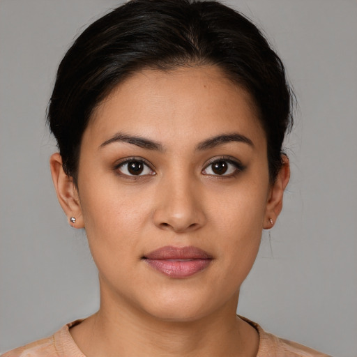 Joyful white young-adult female with short  brown hair and brown eyes
