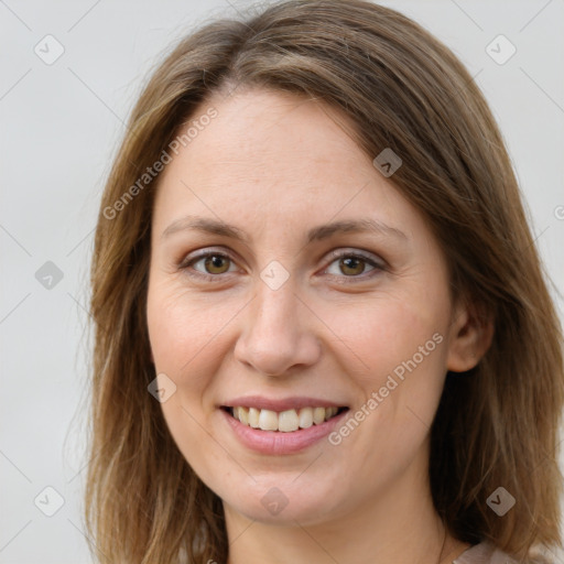 Joyful white young-adult female with long  brown hair and green eyes