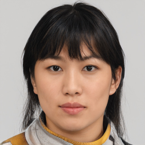 Neutral asian young-adult female with medium  brown hair and brown eyes