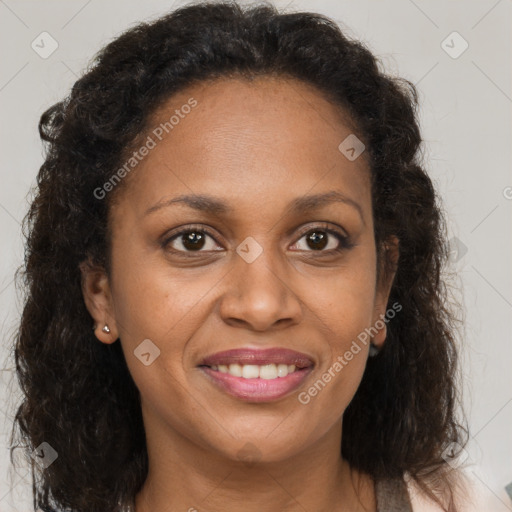 Joyful black adult female with medium  brown hair and brown eyes